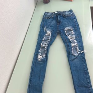 Navy blue, skinny, tight around ankle, ripped